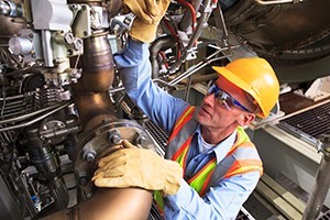 Image of a man checking a machine